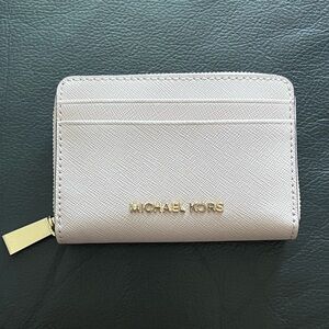 Michael Kors wallet in blush pink.